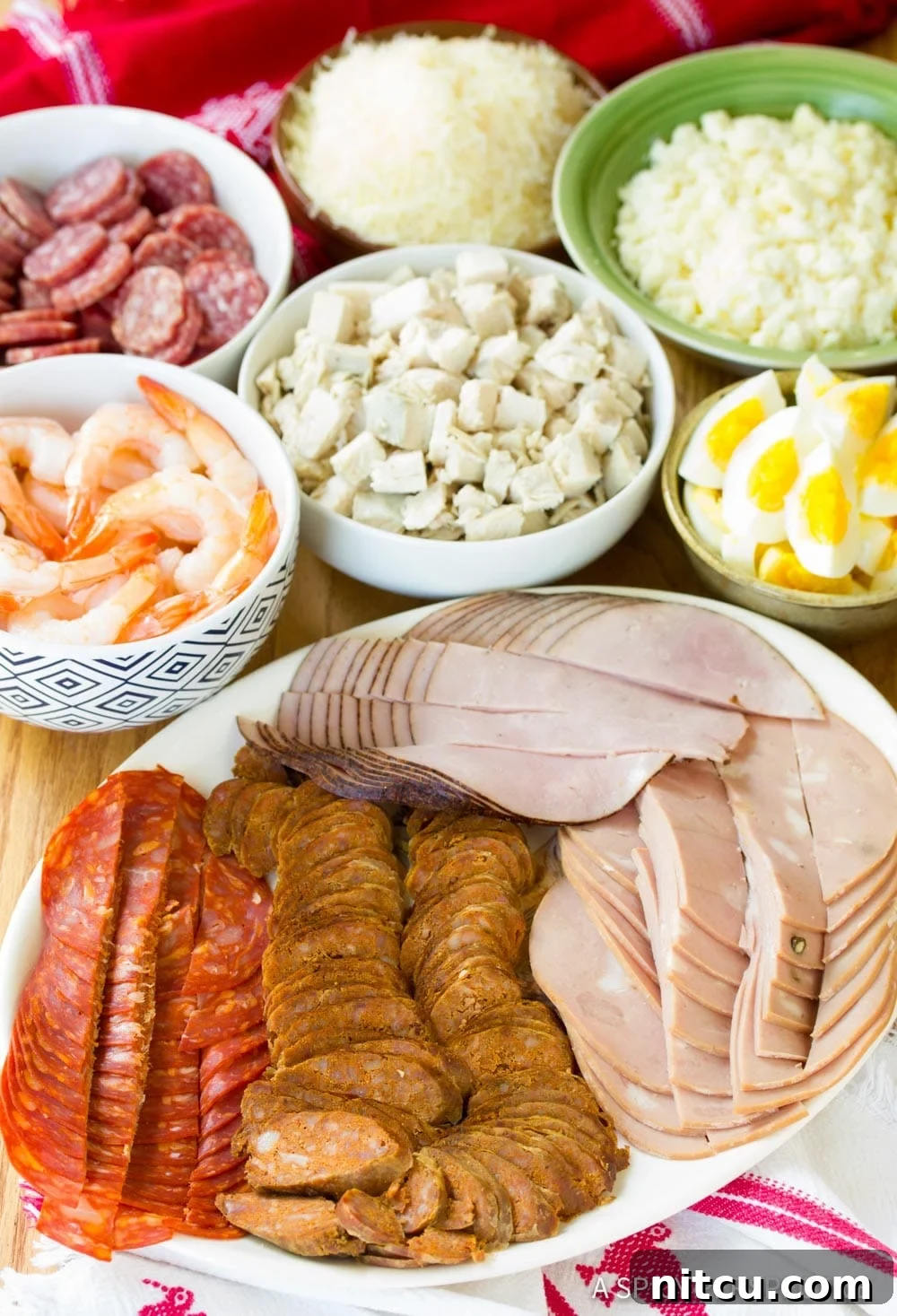More fresh ingredients, including an assortment of vegetables and spices, essential for a traditional Guatemalan Fiambre salad.