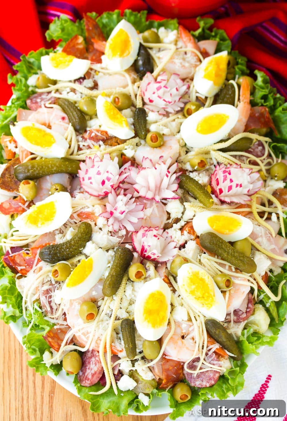 A finished large Guatemalan Fiambre salad, beautifully assembled with all its varied components, ready to be served.
