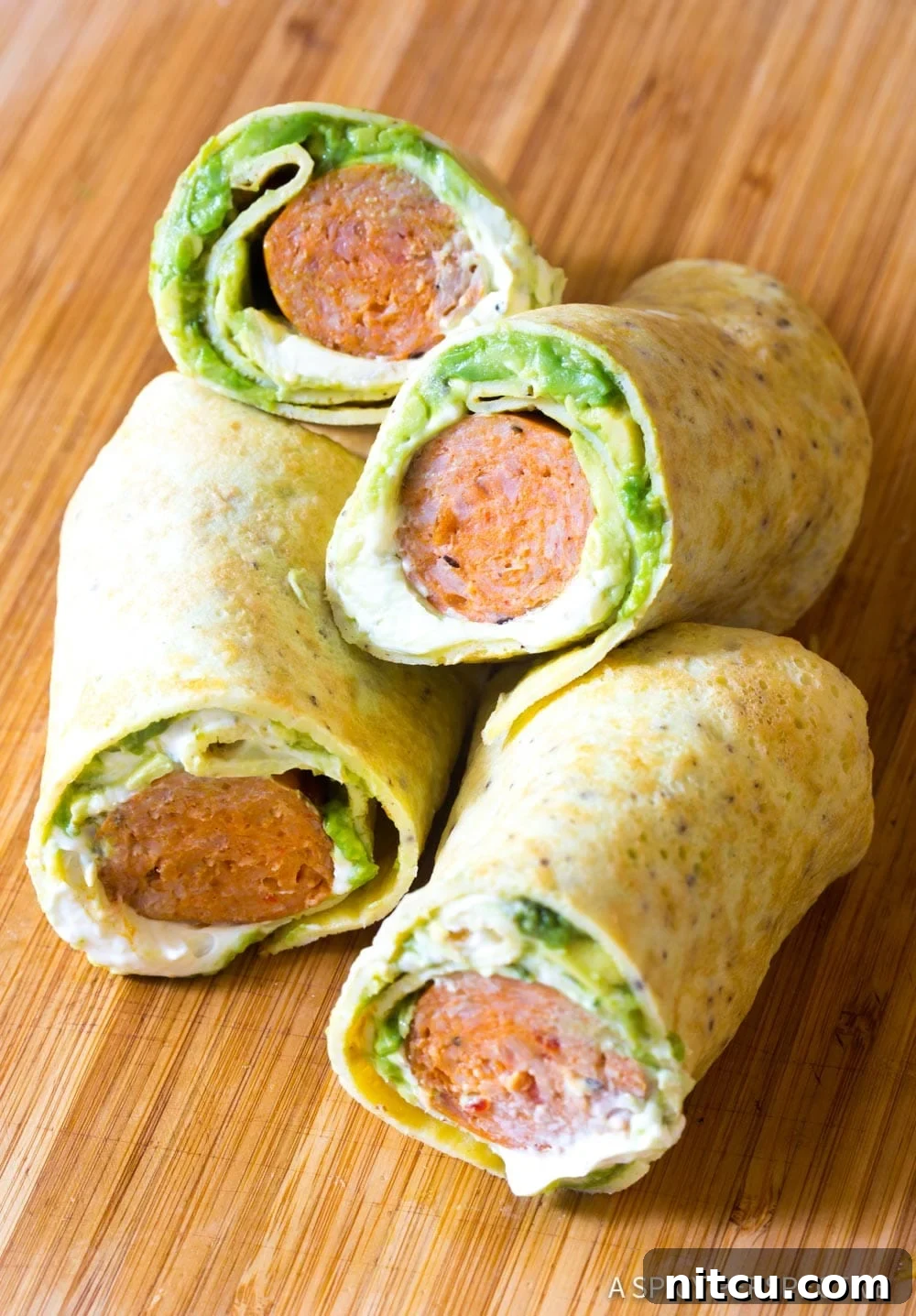 Breakfast egg wraps cut in half and stacked on top of each other. 