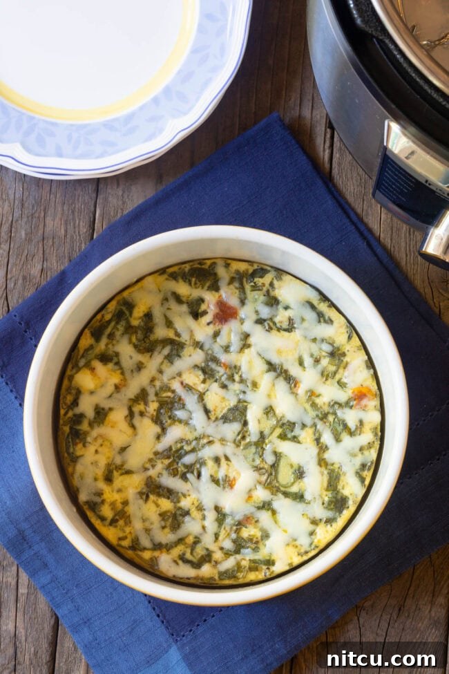 Overhead shot of crustless quiche in a souffle pan, freshly cooked and golden brown.