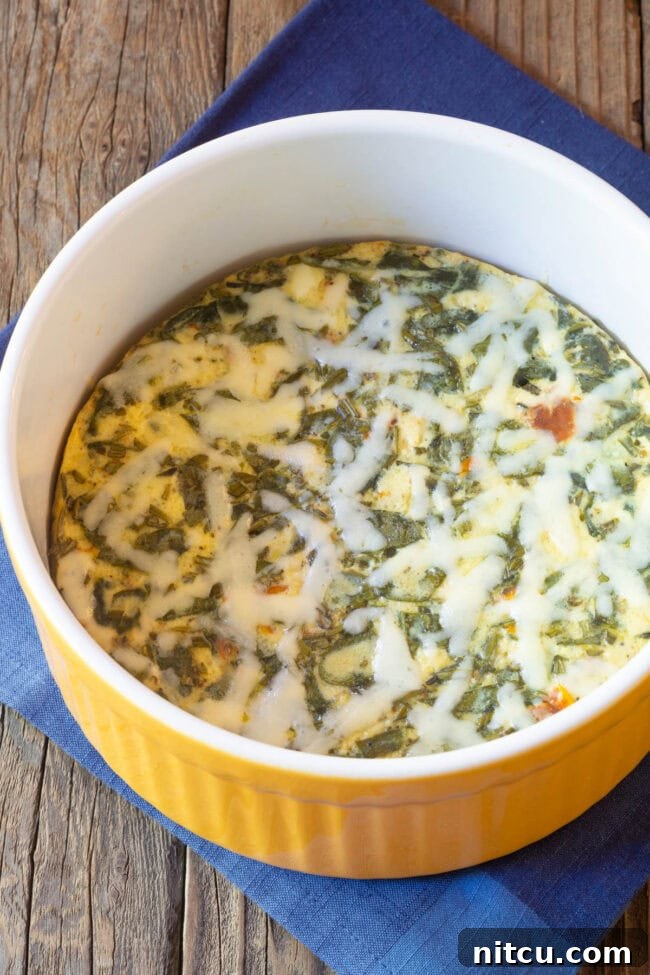 Cooked crustless quiche still in the souffle pan after being removed from the Instant Pot.