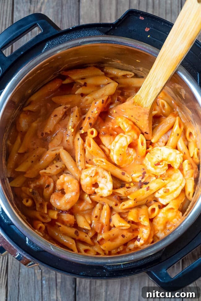 Overhead shot of shrimp pasta with vodka sauce in an instant pot. 