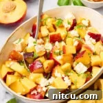 Peach Salad with basil and goat cheese on plates
