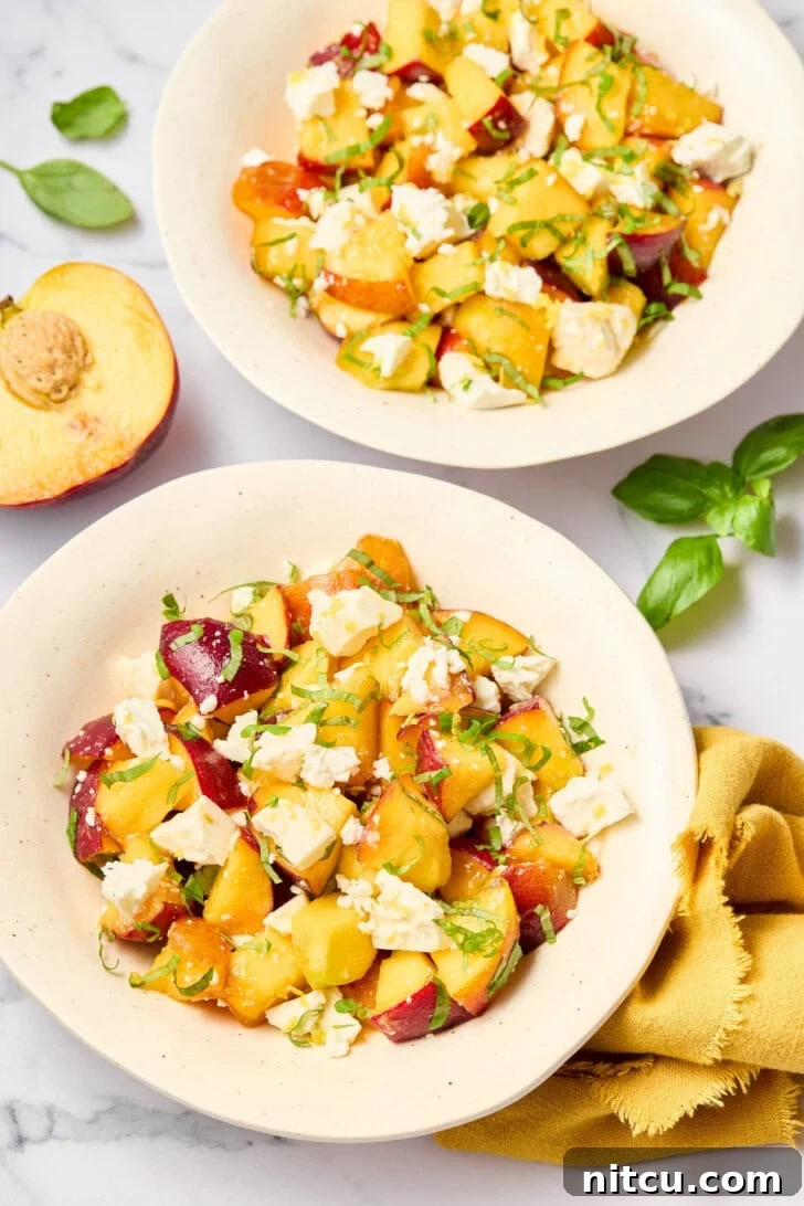 Plates of Fresh Peach and Basil Salad, complete with all ingredients, beautifully arranged for serving in a bright, inviting setting.