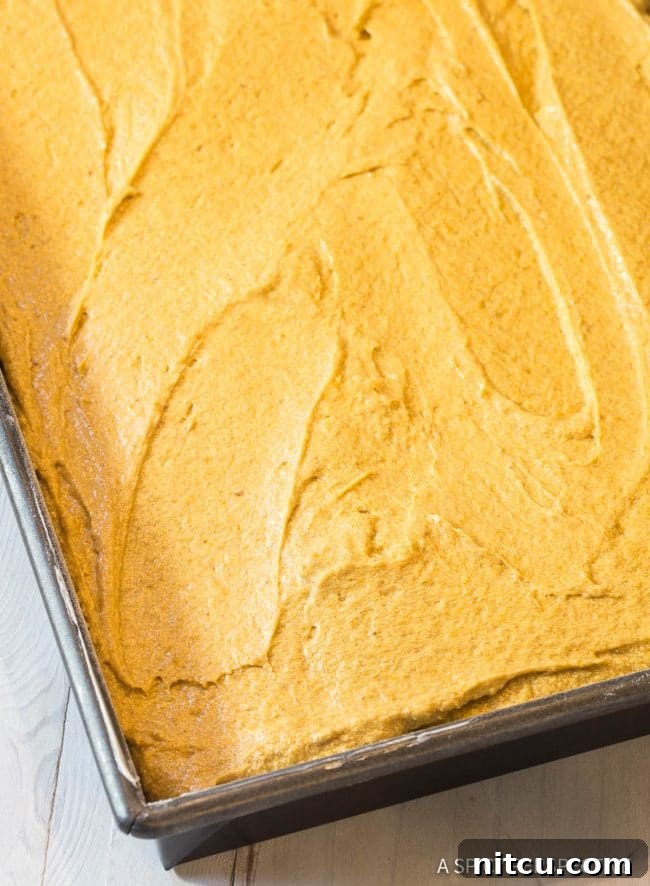 Mixing the dry ingredients for Pumpkin Texas Sheet Cake in a bowl.