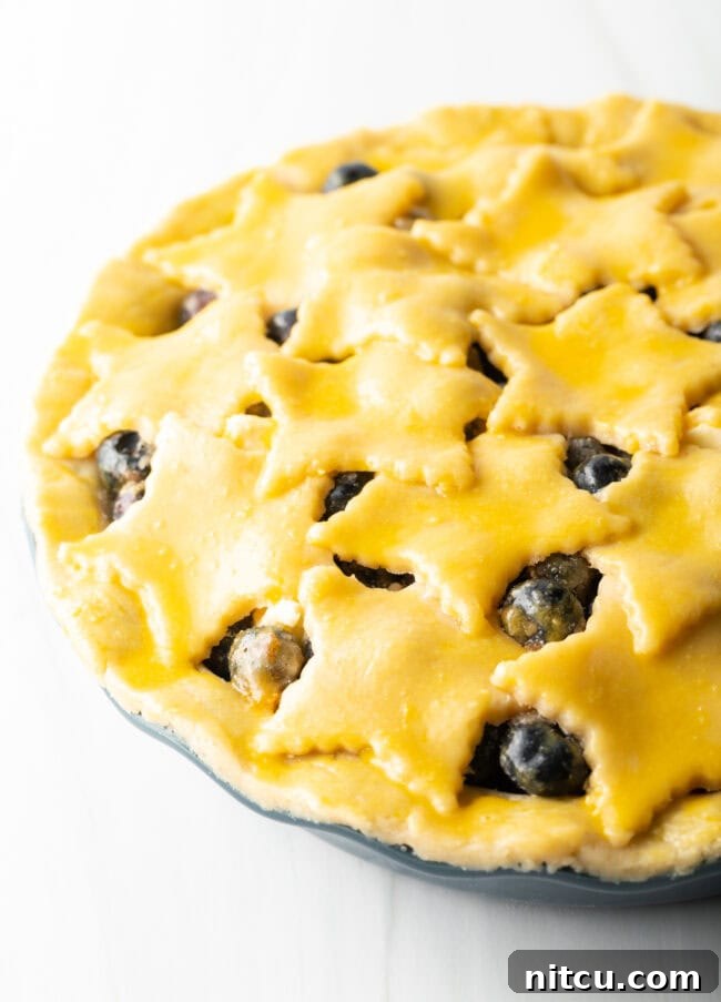 Unbaked Blueberry Pie with Almond Crust, Brushed with Egg Wash
