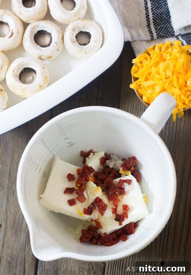The savory filling for the best cheese stuffed mushrooms, perfectly mixed in a bowl, showcasing its creamy texture.