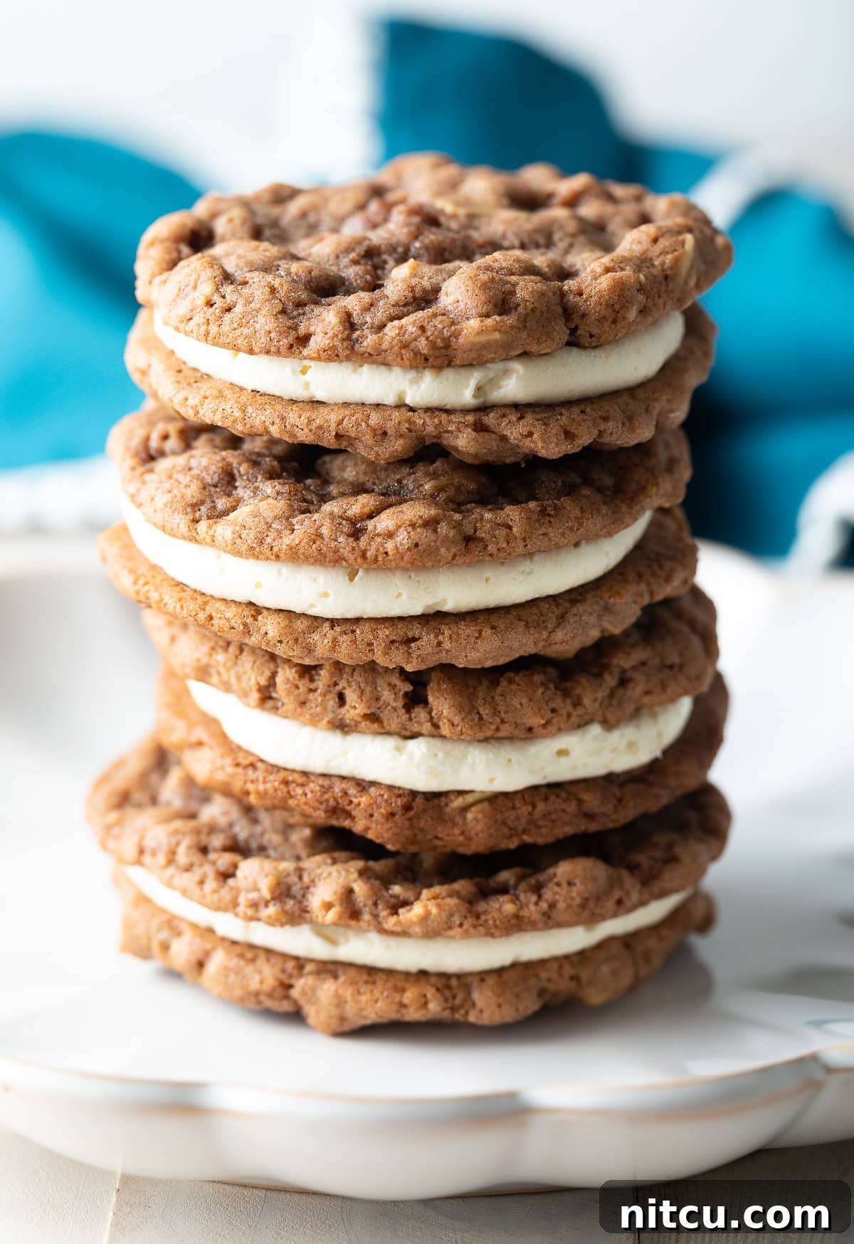 Delicious Homemade Oatmeal Cream Pies stacked on a plate, showcasing their soft texture and creamy filling.