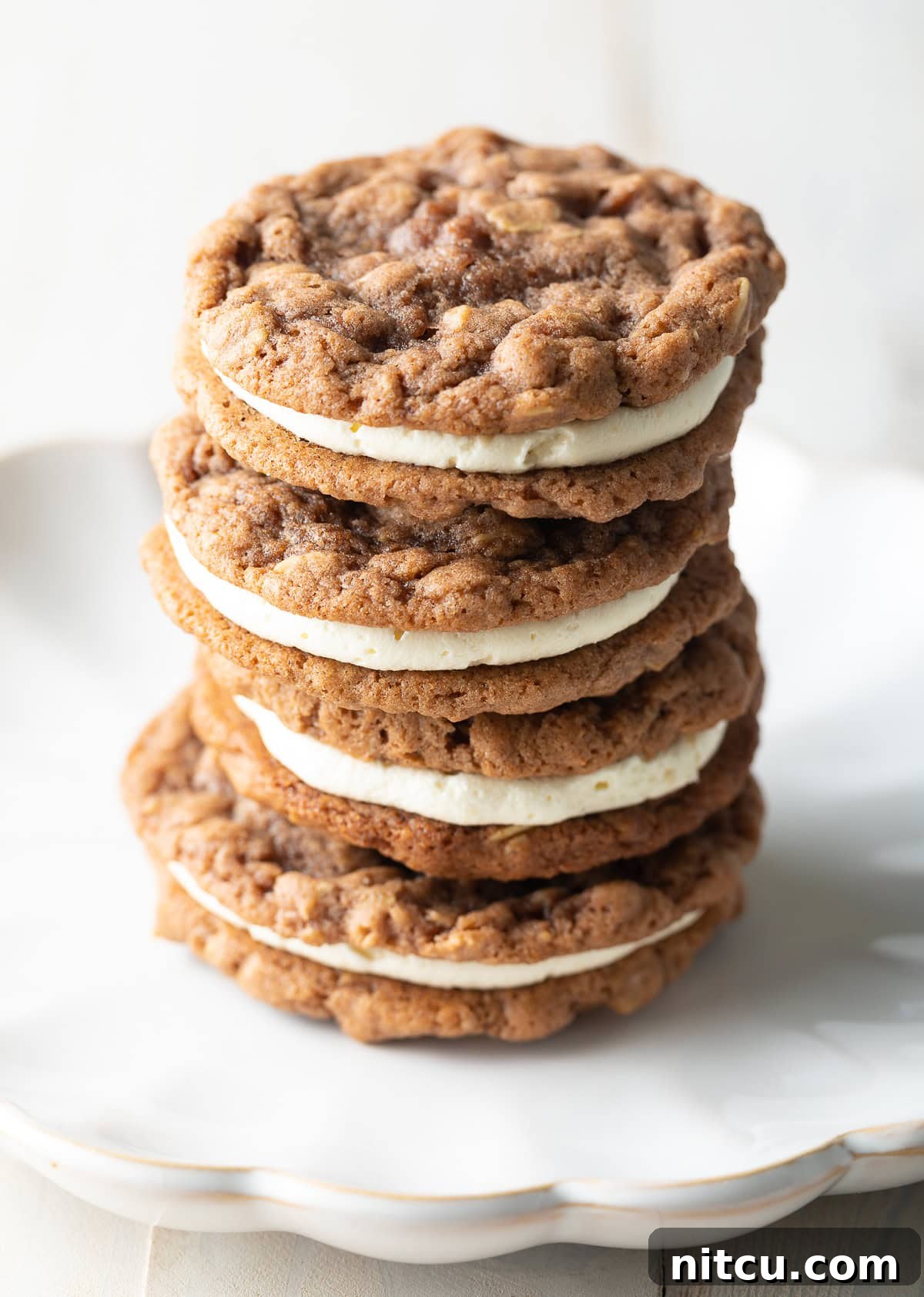 Three exquisite homemade oatmeal cream pies stacked on top of each other, ready to be enjoyed.