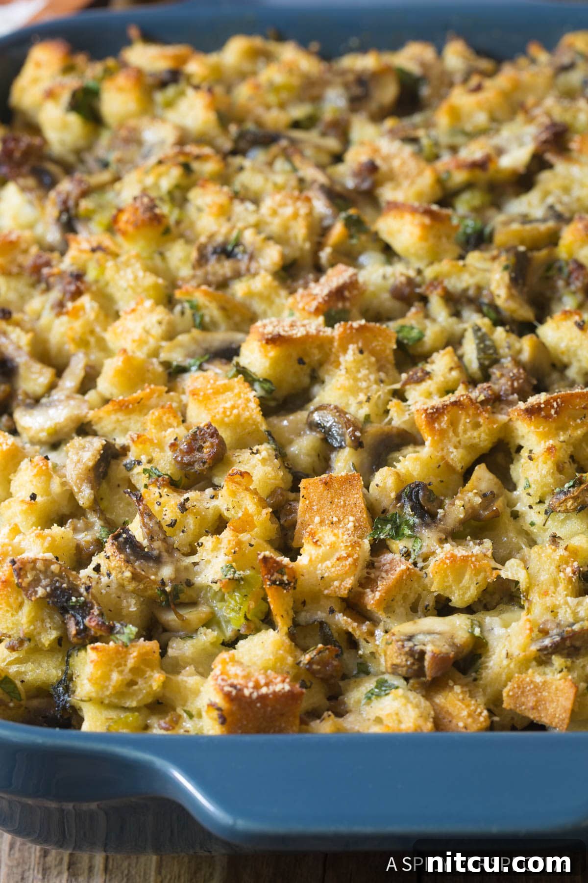 Large pieces of golden brown Mushroom Sausage Stuffing with fresh herbs