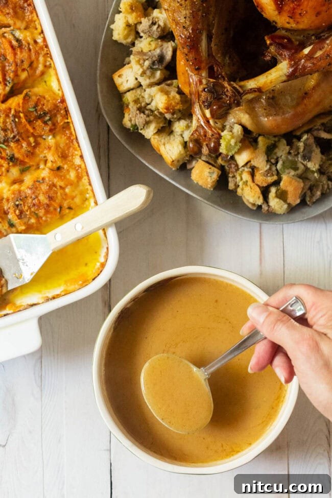 Homemade Turkey Gravy Recipe -overhead shot with Thanksgiving sides.