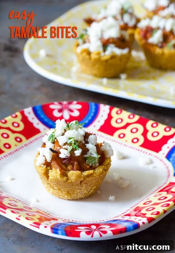 Mini Tamales topped with fresh herbs and crumbled queso fresco, presented elegantly on a serving dish.