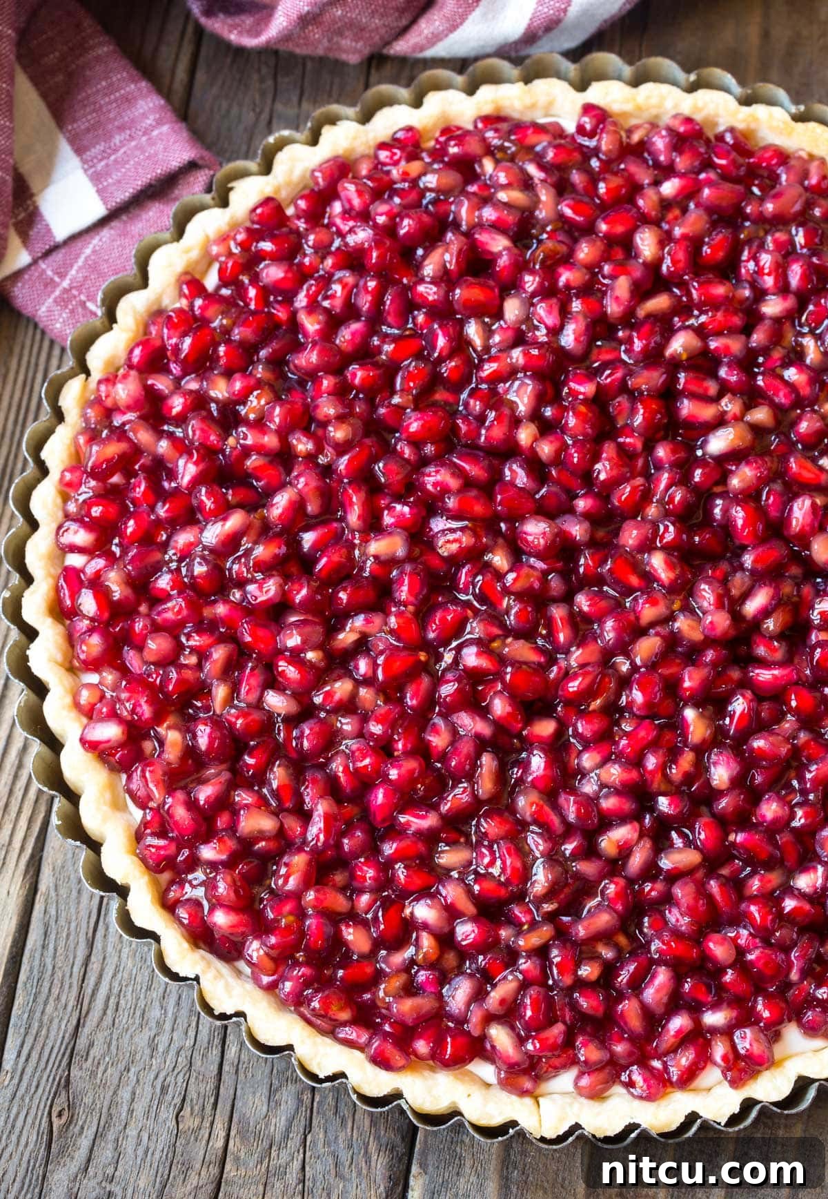 Cream Cheese Tart Recipe with Pomegranate top, overhead shot