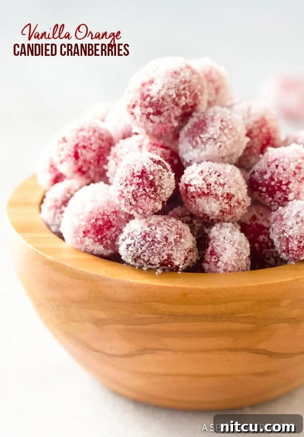 Sparkling Vanilla Orange Candied Cranberries Recipe in a wooden bowl
