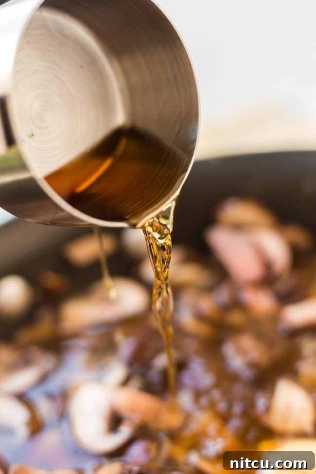 Searing steak for Beef Stroganoff to perfection.