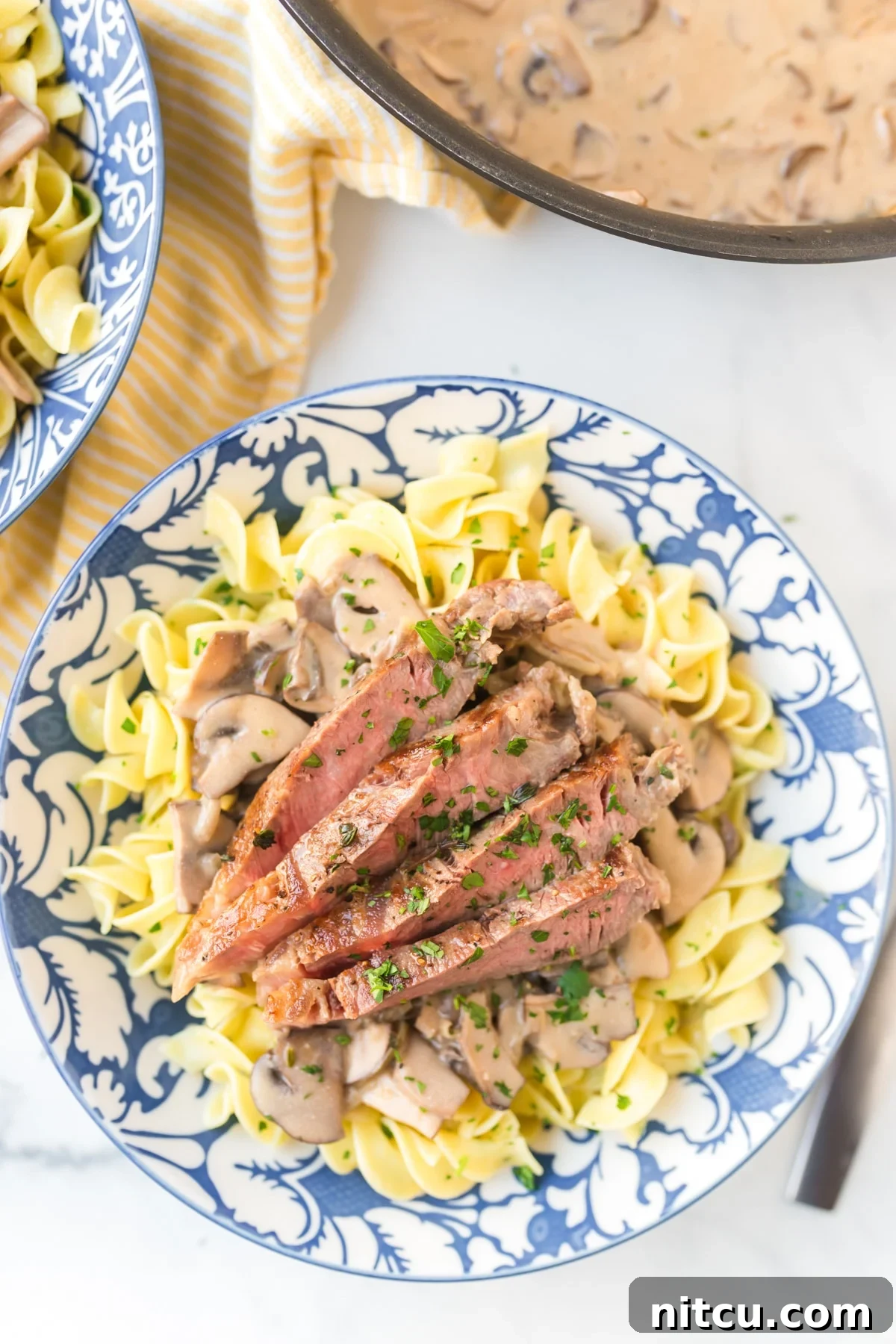 A bowl of delicious Easy Beef Stroganoff with Butter Noodles ready to be served.