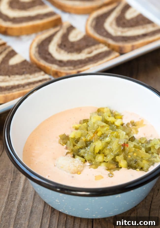 Thousand Island dressing in a small bowl, artfully mixed with horseradish and relish, ready for the sandwiches.