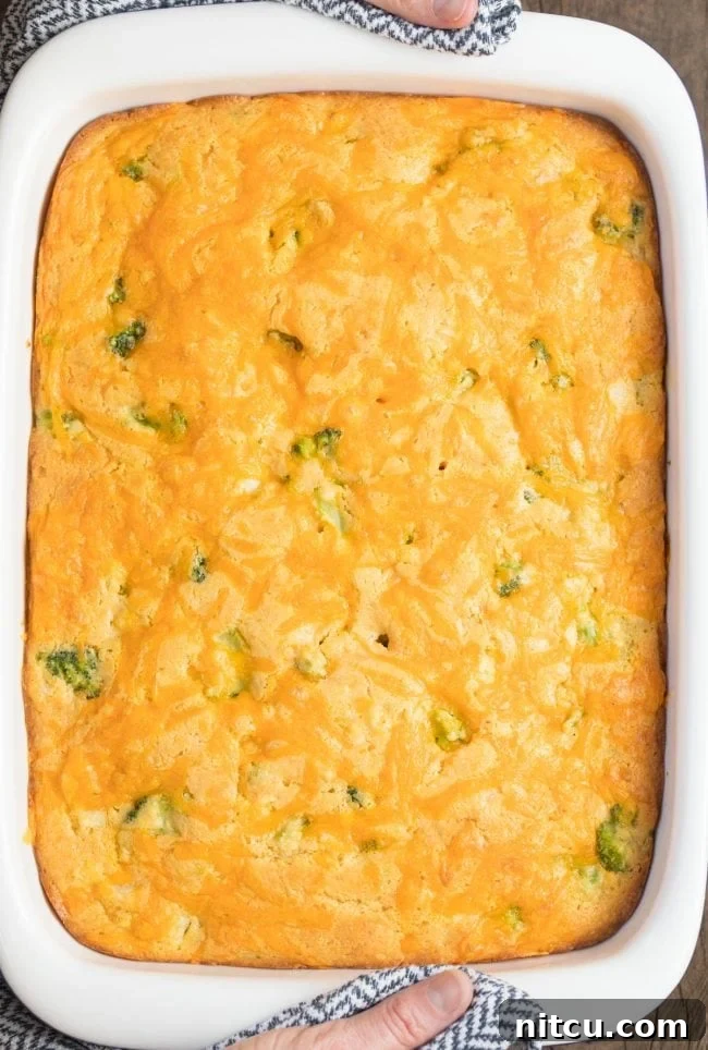 Overhead view of a baking pan filled with golden-brown Broccoli Cornbread