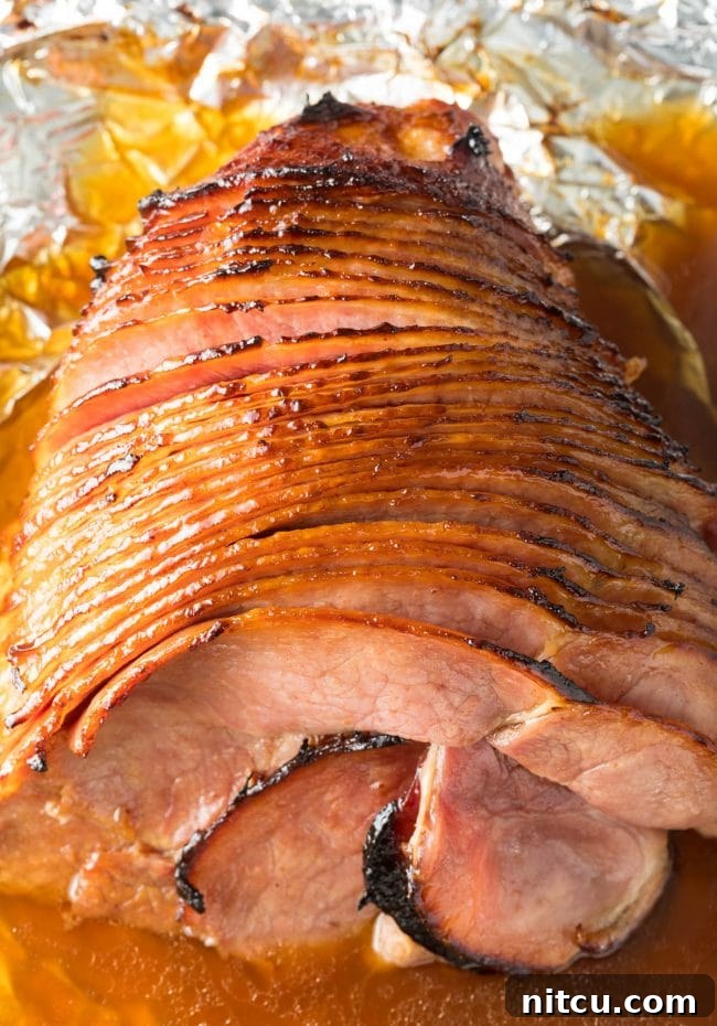 Coca-Cola Baked Ham Recipe overhead shot, showcasing a perfectly glazed, spiral-cut ham ready to serve.