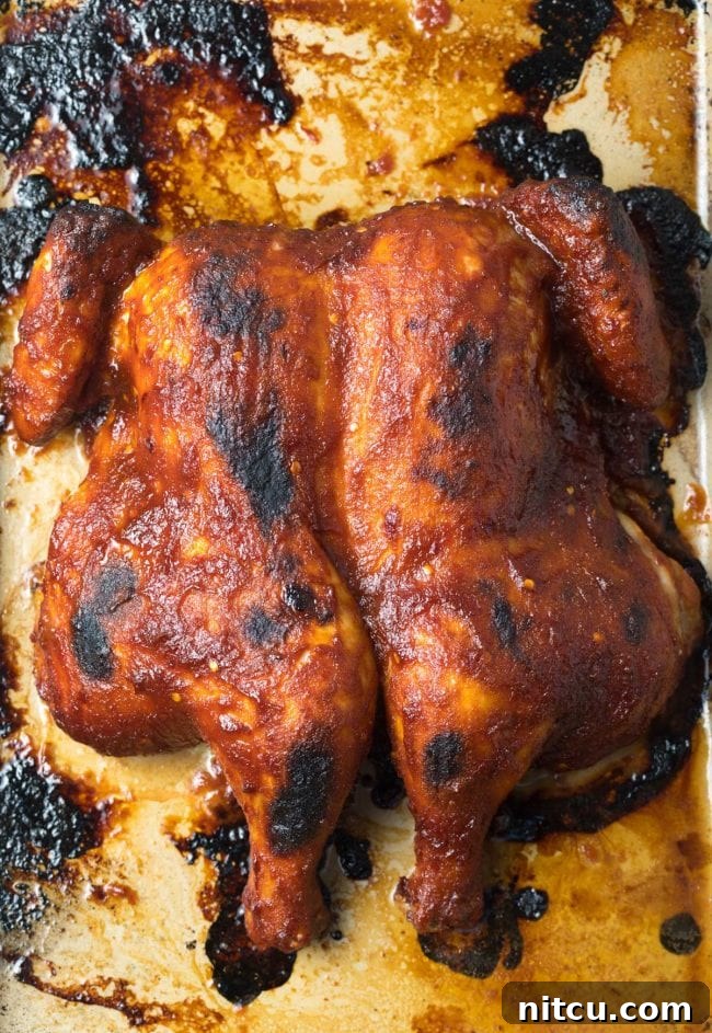 Baked coca cola chicken, glistening and ready to carve.