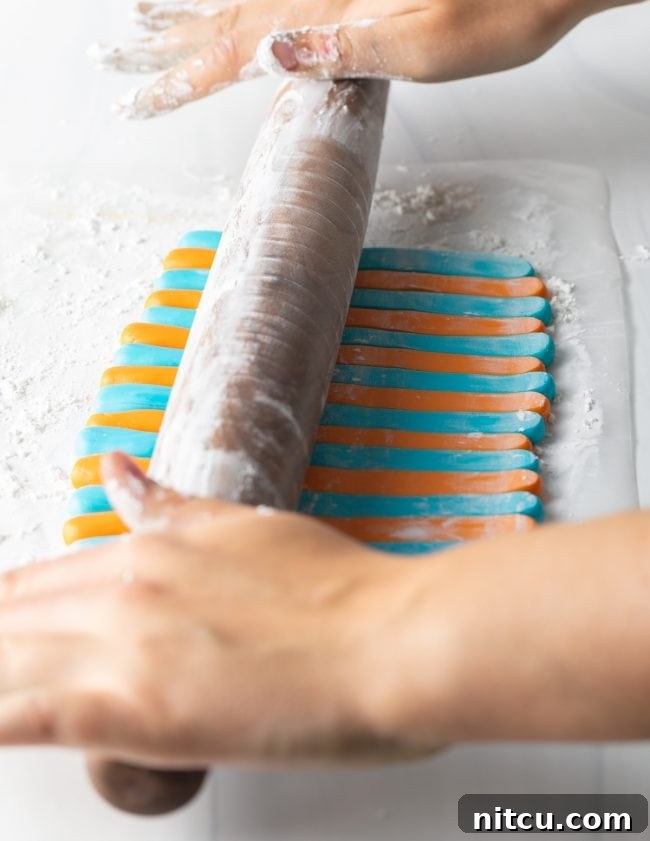 Hand rolling out fondant. 