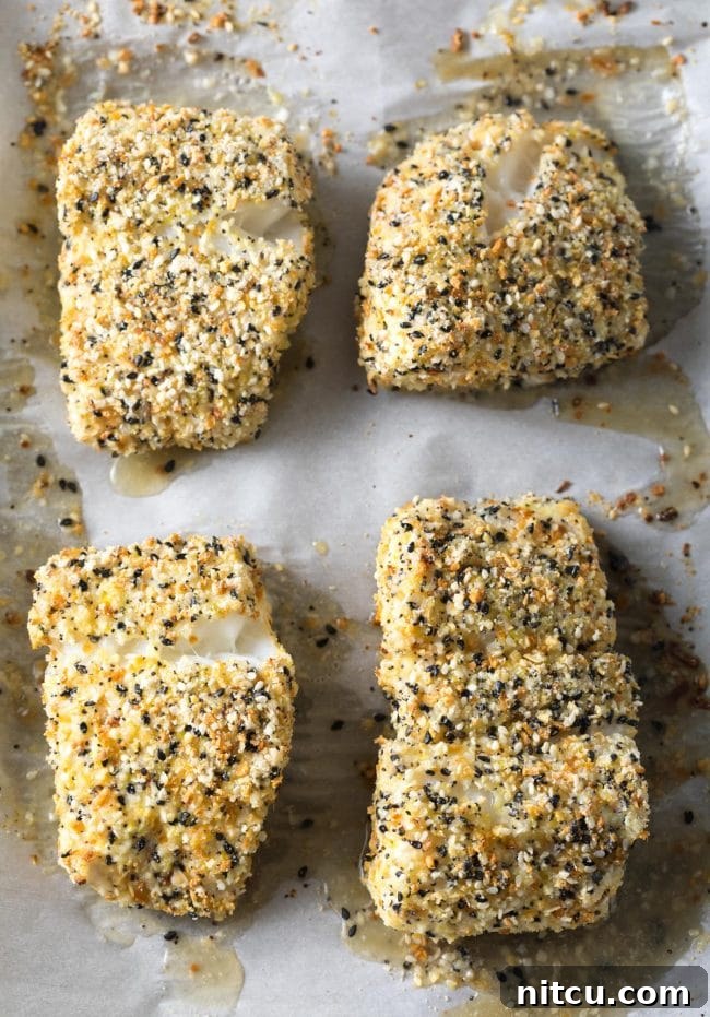 Perfect Baked White Fish with Everything Bagel Crust on a baking sheet. 