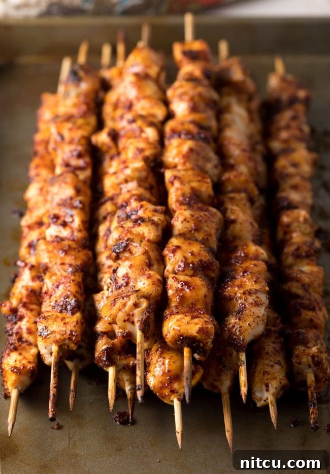 Marinating chicken pieces in a bowl for Korean skewers.