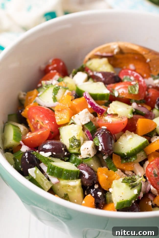 Perfect Greek Horiatiki (Village Salad) Recipe served in a bowl, showing the large chunks of vegetables and feta.