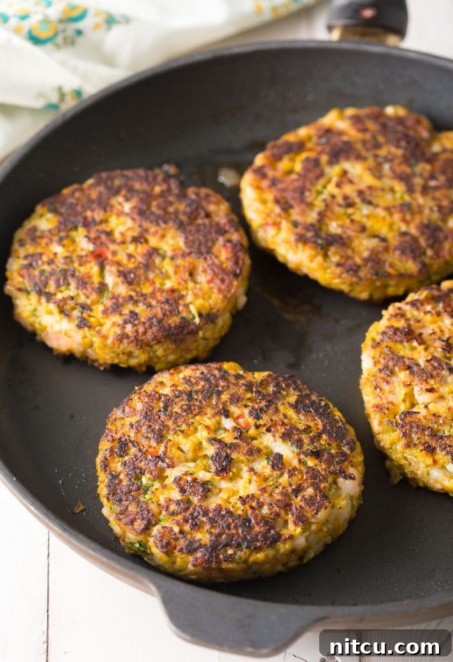 Cooking Caribbean Shrimp Patties in a skillet to perfection