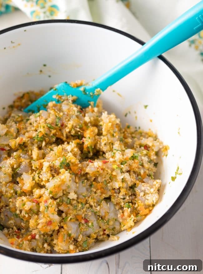 Forming shrimp patties from the seasoned mixture