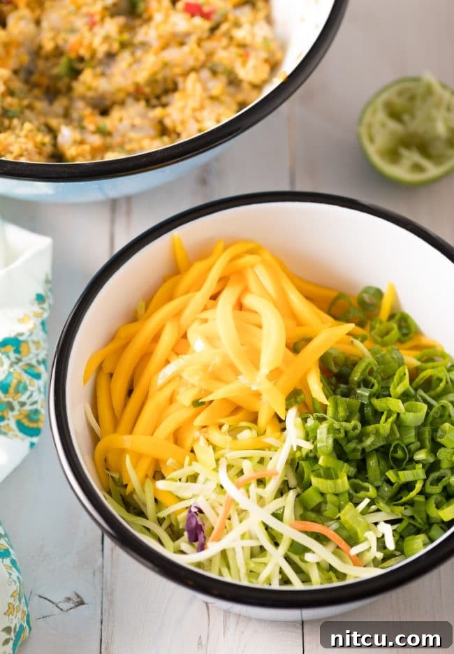 Preparing the fresh and vibrant Mango Slaw for the burgers
