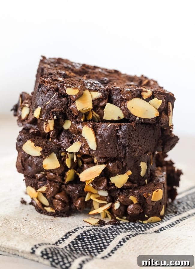 Chunky Chocolate Banana Bread Recipe stacked on napkin
