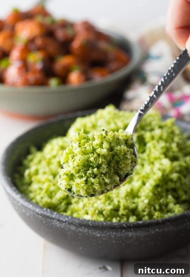 A metal spoon displaying the fine texture of this homemade broccoli rice recipe