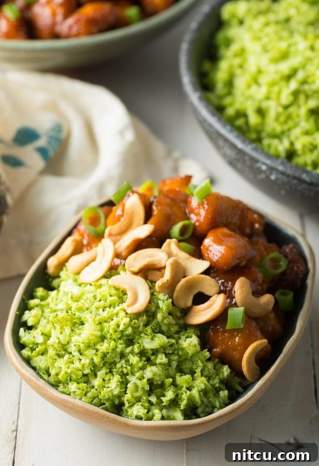 Serving roasted broccoli rice alongside flavorful orange chicken with cashews for a balanced meal