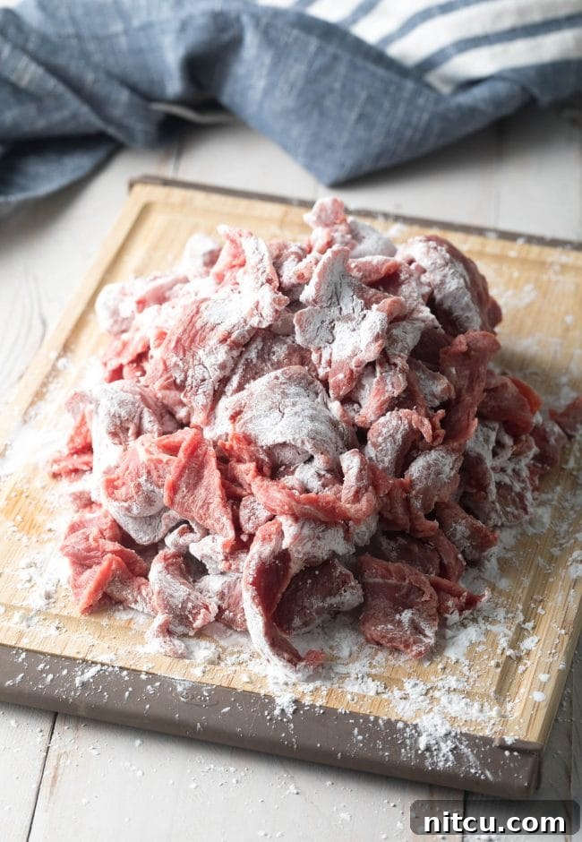 Flour up the schezwan beef recipe before adding it to the wok