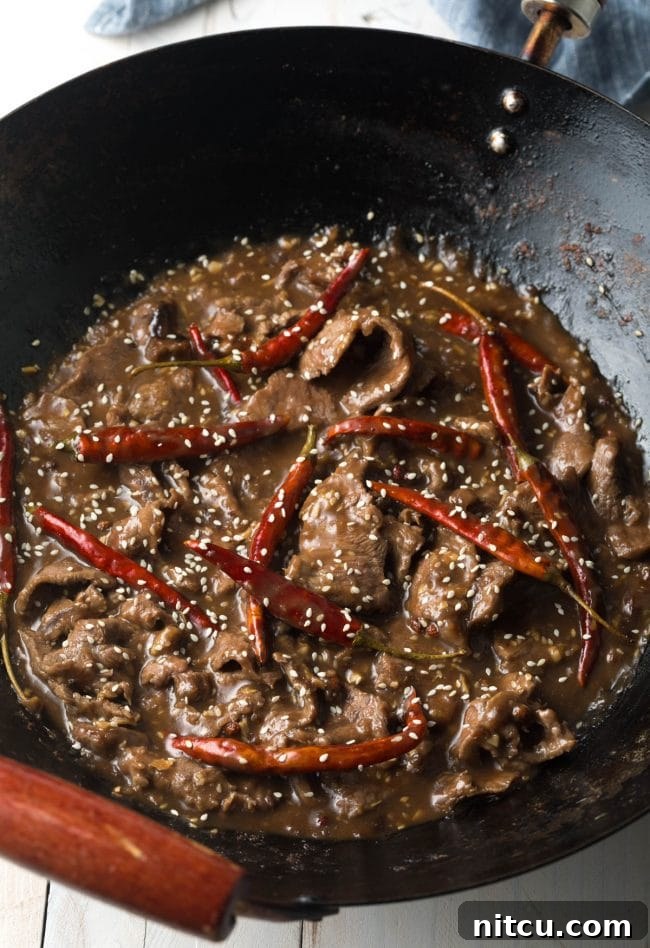 Saute with the peppers and sauces in the pan with the sesame beef