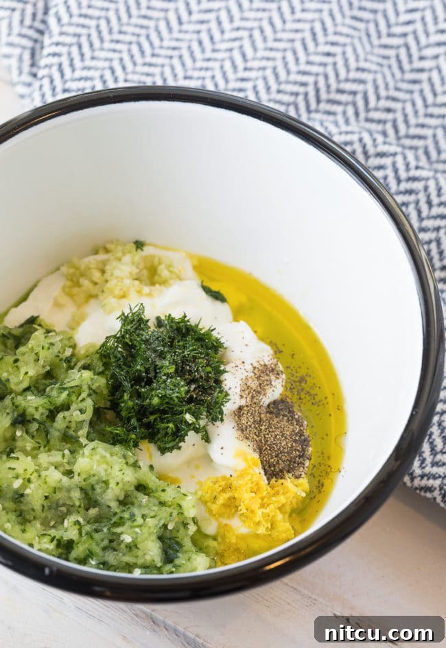 Ingredients for tzatziki sauce in a bowl. 