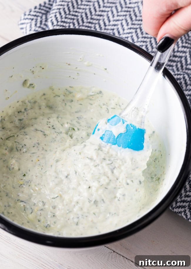 Mixed ingredients for tzatziki in a bowl. 