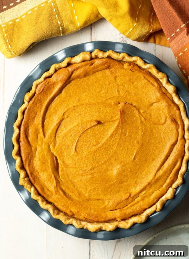 Close-up of baked sweet potatoes, the primary ingredient for a delicious sweet potato pie, showing their natural vibrancy before being mashed and mixed into the filling.