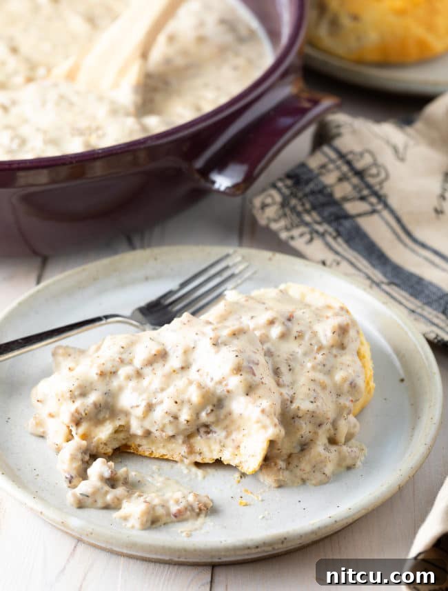 Easy Sausage Gravy and Biscuits on a plate. 