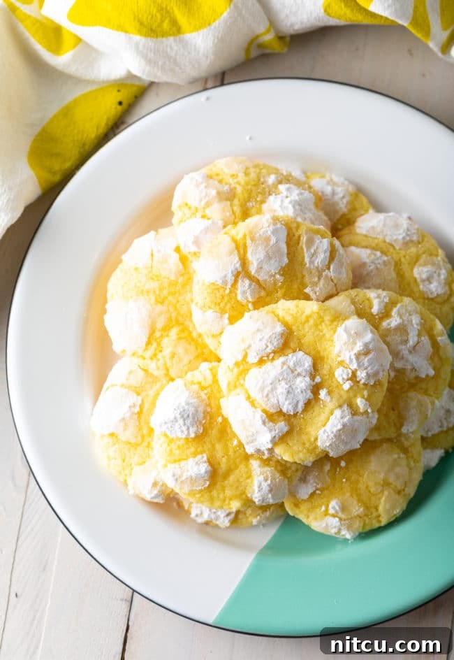 A delightful display of Lemon Crinkle Cookies, perfect for any occasion. #ASpicyPerspective #cookies #lemon #christmas #easter #best #easy