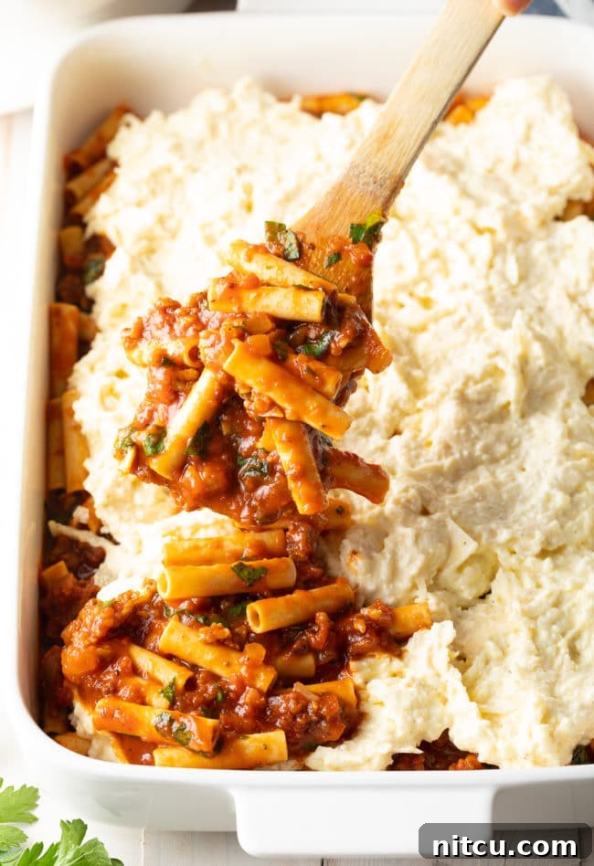 Ricotta Baked Ziti Recipe - layering in pan, showing the uncooked layers