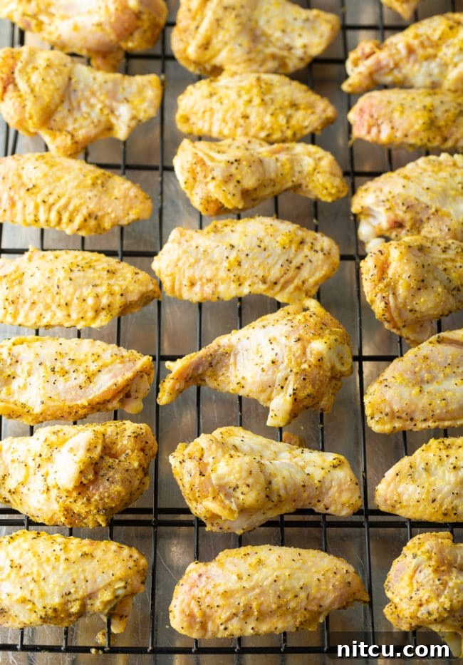 Crispy chicken wings arranged on a baking rack