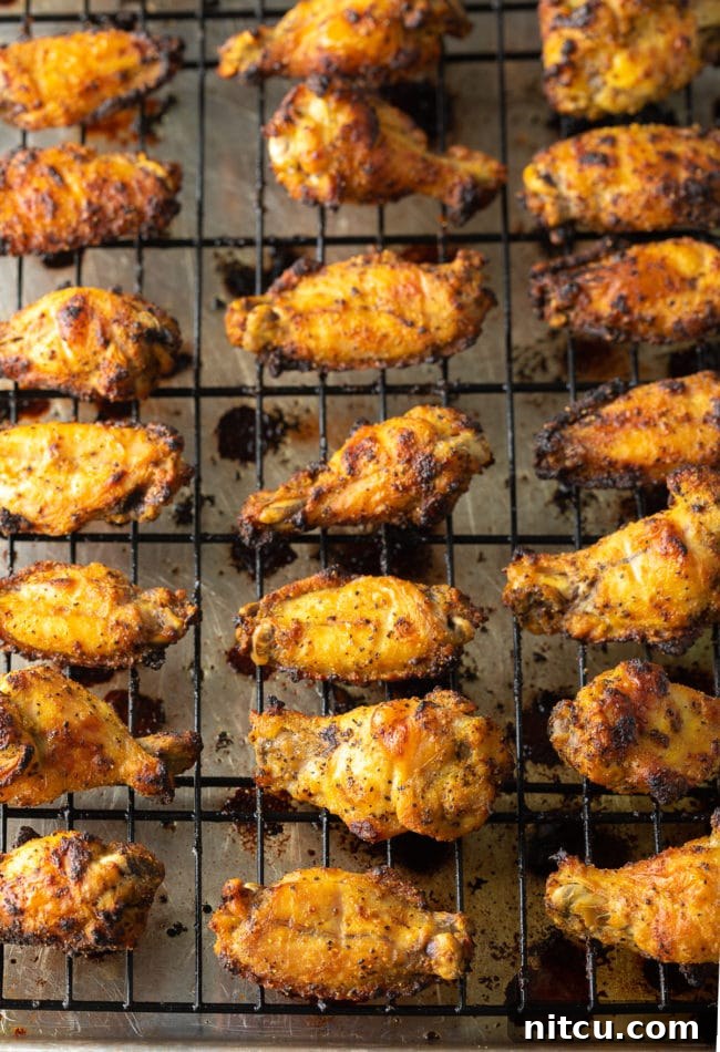 Best Lemon Pepper Chicken Wings Recipe with fresh lemon slices