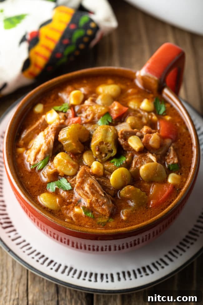 A serving of soup in a large bowl, beautifully presented and steaming.