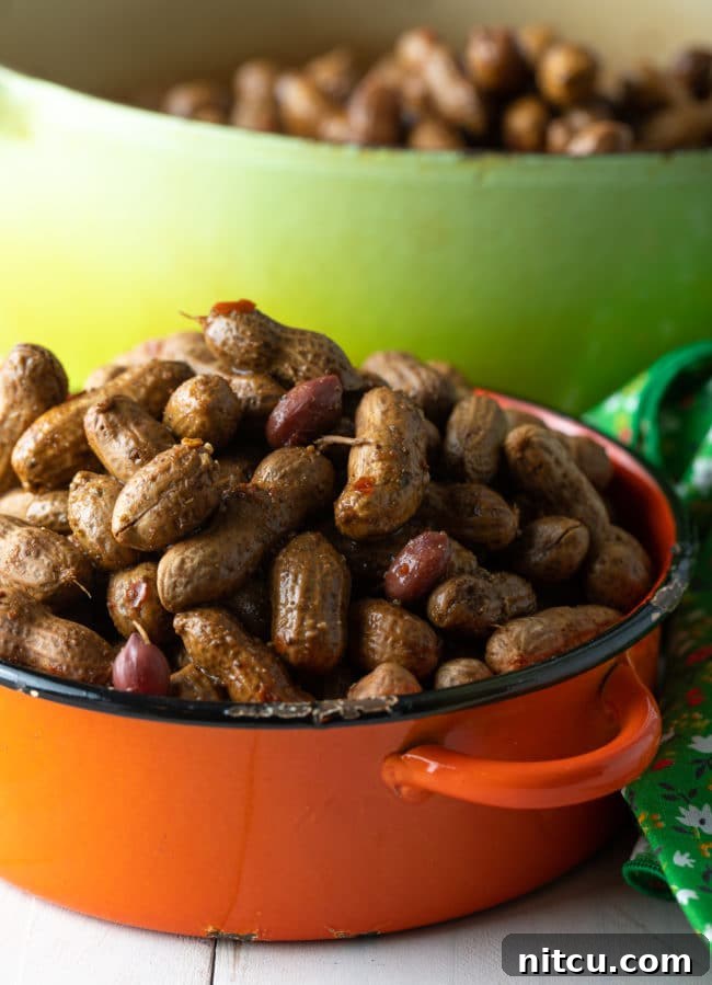 Orange pot filled to the brim with boiled peanuts. 