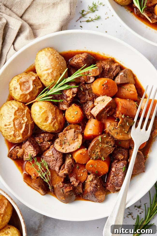 Venison Bourguignon (Deer Stew Recipe) in a white bowl. 
