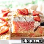 Strawberry-Colada Jello Poke Cake Recipe, a visually stunning dessert.
