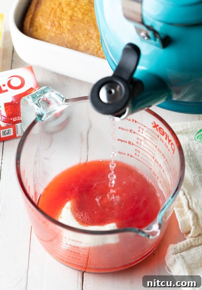 Step-by-step image of how to make Jello Poke Cake, showing the initial mixing phase.