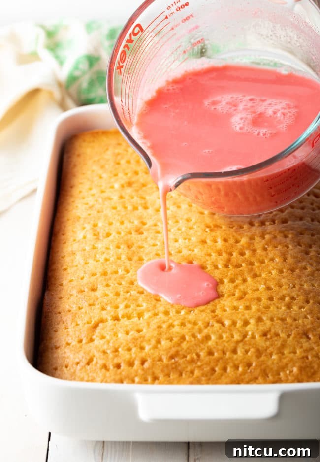 Close-up of Strawberry Pineapple Poke Cake ingredients being combined in a bowl.